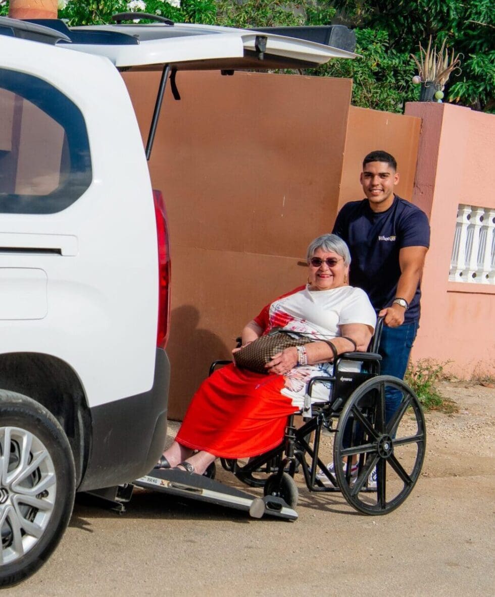 Wheelee driver picking up a client in her wheelchair