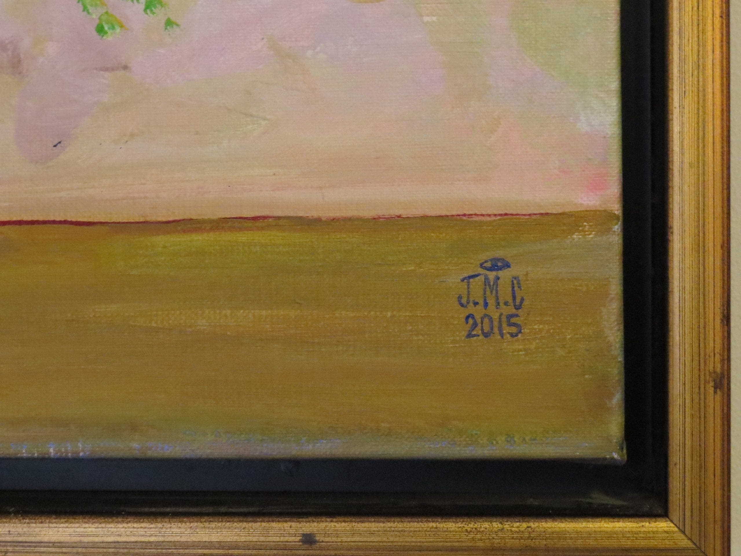 Foto van de signatuur op een schilderij.